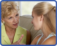 older woman talking to younger woman
